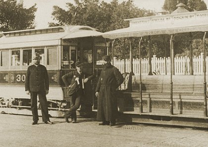 Policeman, conductor and gripman in front of cable tram, c1889. Photograph courtesy National Library of Australia