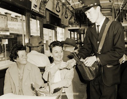 An M&MTB student tram conductor in action in 1963. Photograph courtesy National Archives of Australia